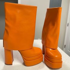 Orange Leather Boots Size 6 Spring Leather Platform Mid-calf Boots, Spring Leather Mid-calf Platform Boots, Bold Platform Boots With Pointed Toe, Spring Mid-calf Boots With Platform In Faux Leather, Spring Mid-calf Platform Boots In Faux Leather, Bold Leather Platform Boots For Party, Bold Heeled Boots With Platform And Round Toe, Bold Platform Heeled Boots With Round Toe, Trendy Boots With Wrapped Heel And Round Toe