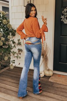 Stay groovy this fall with our 'Amy' pants featuring a medium wash denim material with accent fading and a colorful embroidery design on the back and down the flares! These retro bottoms will take you from season to season, it has a hidden zip fly with a button closure and belt loops, two pockets in the front, none in the back, and a very flattering silhouette that ends in straight floor-length hemlines. Measurements S : Front Rise 10", Hip 30", Inseam 33.5", Length 43", Waist 24". M : Front Ris Stay Groovy, Colorful Embroidery, Denim Material, Plaid Jacket, Model Fits, Tunic Length, Cozy Sweaters, Hip Length, Distressed Jeans