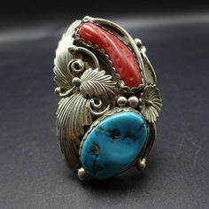 "VINTAGE NAVAJO RING DESCRIPTION: This spectacular ring features Sleeping Beauty turquoise and old red Mediterranean branch coral. The gemstones are secure in scalloped bezel, on a foundation of heavy gauge vintage sterling silver. Highly detailed applied leaves enhance the face of the ring. This impressive ring will be a treasured addition to your collection of fine vintage Native American jewelry. MEASUREMENTS: Ring face measures 2\" x 1 1/4\" Turquoise cabochon measures 20mm x 13mm RING SIZE: Vintage Oval Coral Jewelry, Vintage Coral Oval Jewelry, Red Southwestern Style Collectible Jewelry, Vintage Coral Jewelry For Anniversary, Coral Vintage Jewelry For Anniversary, Vintage Multi-stone Collectible Rings, Vintage Collectible Rings With Large Stone, Vintage Rings With Large Stone For Collectible, Vintage Rings With Large Stone For Collectors