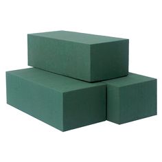 three green foam blocks stacked on top of each other