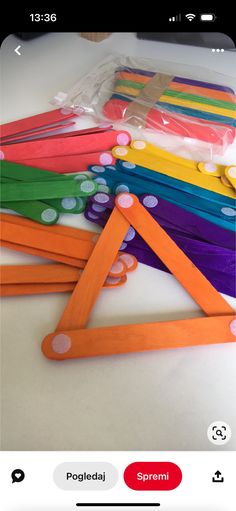 a group of different colored toothbrushes sitting on top of a white table next to each other