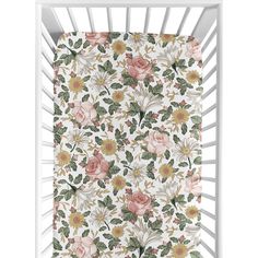 a white crib with flowers and leaves on the bottom, in front of a white background