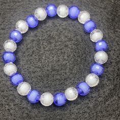 Material: Clear string Color: Purple and white pearls Type: Bracelet Style: Casual Cheap White Braided Bracelet With Colorful Beads, White Beaded Bracelet, Diy Kandi, White Bracelet, White Bracelets, Bracelet Style, White Freshwater Pearl, Pearl Types, Purple And White