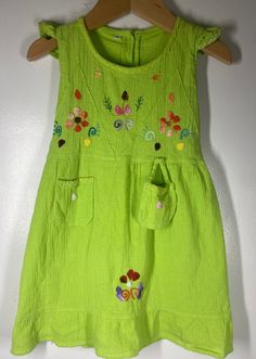 "Labeled sz 4 measures - Ruffle capped sleeves / embroidered floral front / pit to pit 10\"/ waist 10 \"/ length (shoulder to bottom ) 19\" / Little tiny purse attached in the front / Smoke free environment (49)" Green Embroidered Dress For Dress-up, Fitted Summer Dresses With Appliques, Green Embroidered Dress For Dress-up Occasions, Green Floral Applique Dress For Summer, Green Floral Applique Summer Dress, Whimsical Short Sleeve Dresses For Summer, Whimsical Short Sleeve Summer Dresses, Whimsical Sleeveless Beach Dress, Summer Floral Embroidered Playtime Dress