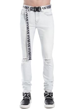 Deconstructed stretch denim puts a street-ready spin on stylish skinny jeans paired with a bold brand belt. 92% cotton, 4% polyester, 4% spandex Hand wash, line dry Imported Stretch Jeans With Belt Loops For Streetwear, Urban Fitted Jeans, Urban Fitted Jeans With Belt Loops, Casual Fitted Belted Jeans, Fitted Casual Belted Jeans, Triangle Embroidery, Winter Knit Hats, Branded Belts, White Belt