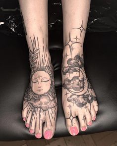 two feet with sun and moon tattoos on them