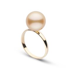 This AAA quality golden South Sea pearl ring showcases the pure organic beauty of a single exotic, deep gold color pearl. The flawless pearl appears to float above the gold, yet is securely attached by a strong post set upon a classic-style ring features a 3 mm, 14-karat gold band. Golden South Sea pearls are among the most sought-after pearls in the world. They are also the most rare, growing in only a few remote locations around the world. The golden pearl set in this ring was grown in the war Pearl Ring Design, South Sea Pearl Ring, Diamond Ring Cuts, Golden Pearl, Green Emerald Ring, Golden South Sea Pearls, Gold Diamond Engagement Rings, Jewelry Appraisal, Sea Pearl