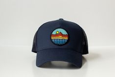 Mountains - Trucker Hat - Navy Blue 65/35 polyester/cotton Mesh back, structured Mid-profile, six-panel Snapback closure Island Holidays, Shell Island, Fragrance Diffuser, Mountain Hiking, Oyster Shell, Glasses Accessories, Trucker Hat, Bath And Body, Accessories Hats