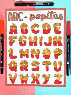 a poster with french fries on it next to marker pens