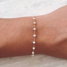 Dainty Handmade Pearl Bracelet, Handmade Dainty Pearl White Bracelets, Dainty Beaded Rosary Bracelet, Beaded Chain Pearl Bracelet Gift, Dainty Handmade Gold Rosary Bracelet, Dainty Pearl Bracelet With Adjustable Beaded Chain, Handmade Dainty Rosary Bracelet, Handmade Dainty Rosary Bracelet With Round Beads, Dainty Handmade Rosary Bracelet With Round Beads