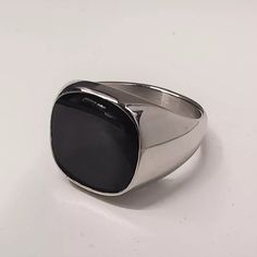 Handcrafted Mens Square Black Onyx Silver Tone Signet Ring - Stone Dimensions: Square 14*14 - Band New With Tags! - Limited Quanity -100% Authentic - Full Retail Package With All Accesories Masculine Black Jewelry For Gift, Classic Black Adjustable Signet Ring, Adjustable Black Signet Ring With Polished Finish, Elegant Black Stainless Steel Signet Ring, Masculine Black Stainless Steel Jewelry, Formal Black Stainless Steel Signet Ring, Masculine Silver Stainless Steel Jewelry, Masculine Stainless Steel Silver Jewelry, Masculine Silver Jewelry Gift