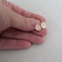 "These simple hammered (or smooth!) earrings are 100% 14k yellow or rose gold filled. The tiny 10mm gold filled discs are customizable in your choice of finish. They are perfect for every outfit, either dressed up or down. 14k gold filled french hook ear wires with a tiny ball at the top. See chart for more finish options. * Tiny 10mm (.4\") YELLOW or ROSE gold-filled discs * Gold Filled is a high-quality long-lasting material, it will not rub off like gold-plating * Gold Filled is usually a gre Hammered Minimalist Adjustable Earrings, Adjustable Hammered Minimalist Earrings, Minimalist Hammered Adjustable Earrings, Dainty Adjustable Hammered Earrings, Adjustable Hammered 14k Gold Earrings, Rose Gold Hammered Dangle Earrings, Dainty Hammered Brass Earrings, Hammered Drop Earrings For Gifts, Hammered 14k Gold Filled Drop Earrings