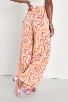 Looking refined and retro is easy to do when you have the Lulus Gettin' Groovy Orange Multi Print Plisse Wide-Leg Pants in your wardrobe! A mesmerizing, swirly multicolored print decorates stretchy and satiny plisse fabric that shapes a high-waisted silhouette and an elasticized waistband that tops breezy, wide leg pants that fall to ankle-length hems. Fit: This garment fits true to size. Length: Floor length. Size small Waist: Fitted - very fitted at natural waist. Hip: Not Fitted - room for hi Plisse Pants, 70s Print, Funky Pants, Plisse Fabric, Lulu Fashion, Orange Print, Printed Wide Leg Pants, Pants Pattern, Small Waist