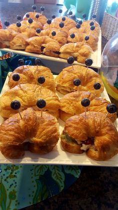 there are many croissants with blueberries on them