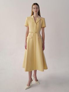 This is BAU by Bride And You’s mini dress, beloved for its classic design, features luxurious textured fabric and jacket-style details on the top, emphasizing a classic mood. The flared skirt adds to its femininity. The V-neck notched collar creates a slender neckline, while the spacious shoulder line covers the arms. Inside the skirt, there's a full lining that accentuates the skirt line, creating a more dimensional silhouette and structural body line.- Perfect for both daily wear and special occasions- Can be styled with various accessories to create different looks- Features a zipper at the back for easy wearing and removal- Pairing it with the optional belt provided will enhance the overall look Luxury Fitted A-line Midi Dress, Spring A-line Single Breasted Dress, Tailored Semi-formal Dress With Structured Boning, Classic Single-breasted Dress For Work, Classic Single-breasted Workwear Dresses, Formal Midi Dress With Fitted Waist And A-line Shape, Spring Semi-formal Midi Dress With Fitted Bodice, Fitted Workwear Dresses With Structured Boning, Classic Knee-length Dress With Fitted Waist