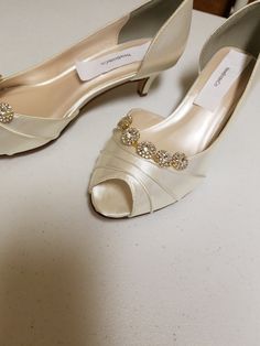 "THIS LISTING IS FOR: US Size 8W Ivory, as shown in pics is ready to ship; HEEL: 1 3/4\" INSIDE LENGHT: 9 3/4\" MEASURE YOUR FEET LENGHT TO ENSURE FIT, FINAL SALE! Wedding Peep toes satin shoes! Hand embellished with a beautiful set of Crystals brooches Please look at the pictures for details! Heel hight in the picture is: 1 3/4'' inches, OTHER SIZES AVAILABLE: COLORS OF SHOES: WHITE, IVORY, OFF-WHITE, CHAMPAGNE COLORS OF JEWELRY: GOLD, OR SILVER To order color samples: www.etsy.com/listing/1297 Elegant Gold Low Heel Wedding Shoes, Elegant Gold Fitted Kitten Heels, Open Toe Kitten Heels For Wedding, Gold Low Heel Wedding Shoes, Classic Gold Heels For Wedding, Elegant Gold Kitten Heels, Gold Round Toe Kitten Heels, Gold Low Heel Fitted Wedding Shoes, Gold Fitted Low Heel Wedding Shoes