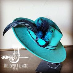 If you’re looking for the perfect accessory to complement your favorite boho style, look no further. This Boho-Style Western Felt Hat w/ Natural Feather & Turquoise Hat Accent by The Jewelry Junkie is absolutely everything that you need. Not only is it easy to incorporate into any and all outfits, but the genuine leather and natural feathers of the band immediately elevate whatever it is you’re wearing. One Size Hat with adjustable inner hat liner (see last photos) The same primary feathers will Hat Customization, Mens Dress Hats, Womens Fedora, Painted Hats, Chapeau Cowboy, Western Hat, Leather Hat, Feather Hat, Unique Hats