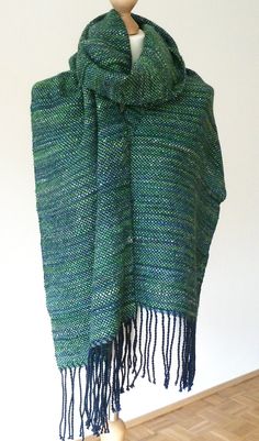 "I hand wove this scarf/shawl using luxury handspun and handdyed yarn made from natural fibres. I used a handspun handdyed yarn made of baby alpaca fleece, seacell & Angelina sparkle (weft) and a navy Merino silk yarn (warp). It is next to skin soft and extra wide so it could be used as a scarf or shawl. The seacell & silk give it a luxurious sheen measurements: approx. 210 x 35 cm / 82.5\" x 14\" (without fringe) and 236cm/ 92.5\" long (with fringe) materials: baby alpaca, seacell & silver Ange Hand Knitted Alpaca Shawl Scarves, Bohemian Handwoven Alpaca Scarves, Green Bohemian Handwoven Shawl, Bohemian Alpaca Hand Knitted Shawl, Handwoven Alpaca Shawl, Handwoven Winter Shawl, Handmade Mohair Shawl Scarf, Handmade Alpaca Shawl One Size, Bohemian Hand Knitted Alpaca Scarves