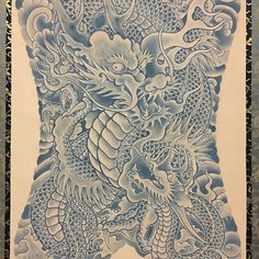 a blue and white painting with two dragon on it's back, in front of a black background