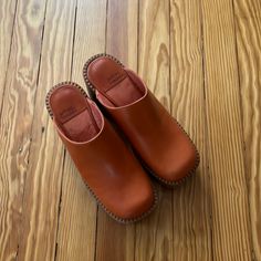 Like New - Worn Once Casual Orange Slip-on Mules, Casual Orange Clogs With Rubber Sole, Orange Closed Toe Clogs With Rubber Sole, Spring Orange Closed Toe Mules, Casual Orange Leather Mules, Orange Round Toe Clogs With Rubber Sole, Spring Brown Clogs With Stitched Sole, Casual Orange Closed Toe Mules, Spring Orange Round Toe Mules