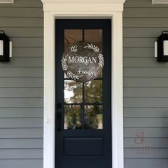 a black front door with a sign that says the morgan family