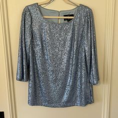 Comfortable And Flattering Sequin Top. Round Neckline With ¾ Sleeve. Darts At Bust Allow This Loose Top To Fall Without Looking Sloppy. Nwot, Looks Brand New. Elegant Light Blue Top For Evening, Elegant Light Blue Tops For Night Out, Elegant Light Blue Top For Night Out, Elegant Blue Sequined Tops, Blue Sequined Blouse For Spring, Blue Sequin Top, Evening Tops, Alex Evenings, Loose Top