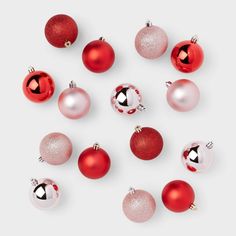 red and white christmas ornaments arranged in a circle