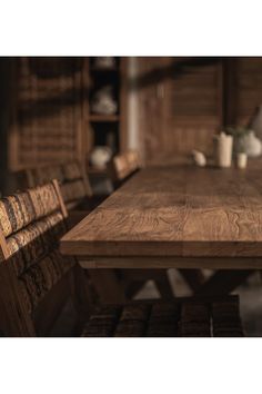 a wooden table with chairs around it