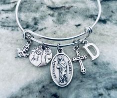 To Personalize... Use this link if you would like to add Birthstones to this bracelet ~ https://www.etsy.com/listing/774404837 Angel Raphael charm securely attached to a silver plated Expandable Adjustable Bangle Bracelet. Meaningful Charm Bracelet; great gift idea! This can be sent directly to your intended with your personal message included. My bangles are expandable ensuring the perfect fit for every wrist. Each Bangle is made with the Best Quality components to be Durable and Sturdy yet wit Spiritual Silver Charm Bracelet For Mother's Day, Personalized Spiritual Silver Charm Bracelet, Mother's Day Silver Spiritual Charm Bracelet, Mother's Day Spiritual Silver Charm Bracelet, Customizable Silver Spiritual Bracelets, Angel Raphael, Bangle Making, Charm Bracelet Silver, Archangel Raphael