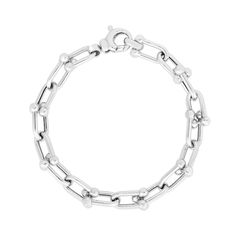 With a sleek and unique design, this silver link chain bracelet instantly elevates your attire. Hollow sterling silver Oval-shaped interlocking links with polished bead accents 9.2mm-wide chain 8.0 inches; lobster claw clasp Modern Polished Chain Link Bracelet, Silver Cable Chain Link Bracelet, Silver Oval Link Chain Bracelet With Cable Detail, Classic Silver Chain Paperclip Bracelet With Oval Links, Modern Silver Chain Bracelet With Rectangular Links, Silver Cable Chain Bracelet With Oval Links, Classic Silver Paperclip Bracelet With Oval Links, Sterling Silver Bracelet With Cable Chain Design, Classic Paperclip Bracelet With Oval Link Silver Chain