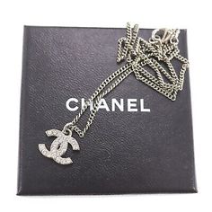 CHANEL CC Logos Used Necklace Rhinestone Silver F12 W France Vintage #CN94 M  | eBay Chanel Logo Necklace Silver, Formal Silver Jewelry With Logo Charm, Luxury White Gold Necklaces With Rhinestones, Formal Silver Necklace With Logo Charm, Luxury White Gold Necklace With Rhinestones, Elegant Silver Necklace With Logo Charm, Elegant Evening Jewelry With Logo Charm, Luxury Diamond Rhinestone Necklace, Luxury Silver Rhinestone Necklace With Cubic Zirconia