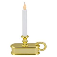 a gold candle holder with a white candle