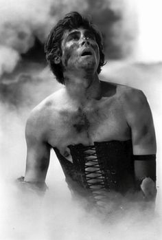 a man in a corset with steam coming out of his chest and eyes