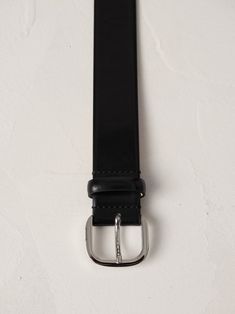 The Jeanne is an elegant and easy way to modernize your wardrobe. Handcrafted in Italy from semi-gloss black leather and featuring an understated buckle, its clean lines epitomize the essence of discreet luxury. Each element of this accessory has been meticulously considered, resulting in a timeless piece that exudes a refined aesthetic. Refined Aesthetic, Gloss Black, Black Belt, Leather Working, Clean Lines, Timeless Pieces, Black Silver, Calf Skin, Timeless Fashion