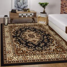 a living room with a large rug on the floor next to a couch and coffee table