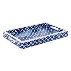 a blue and white tray with an intricate pattern on it, sitting on a white surface