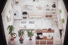 an aerial view of a kitchen and living room in a small apartment with white brick walls