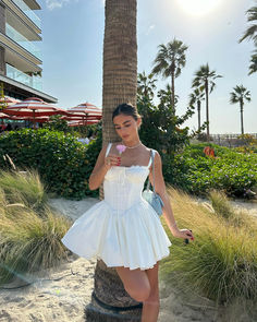 Beach Mini Corset Dress, Fitted Mini Corset Dress For Beach, Beach Mini Length Fitted Corset Dress, Elegant Mini Corset Dress For Beach, Elegant Beach Corset Dress Mini Length, Fitted Mini Length Suspender Dress For Brunch, Fitted Mini Suspender Dress For Brunch, Brunch Fitted Mini Suspender Dress, Summer Fit And Flare Mini Corset Dress