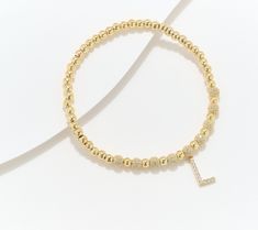 With a low-fuss stretch design and a shimmery, substantial initial charm, this 14K gold-plated bead bracelet is you -- or your favorite gift recipient -- to the letter! Initial Charm, Bead Bracelet, Favorite Things Gift, Jewelry Bracelets, Initials, Gold Plate, Beaded Bracelets, Plating, Bracelet