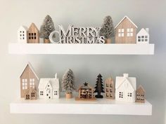 two white shelves with christmas decorations on top of them and the words merry christmas above them