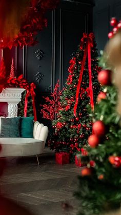 a living room decorated for christmas with red and green decorations