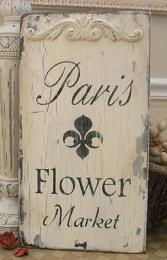 a sign that says paris flower market on it