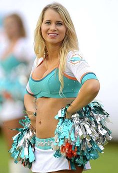 a cheerleader is posing for the camera