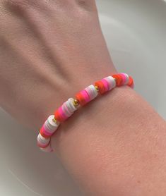 red, pink and white themed bracelet!🤍 Perfect gift for your anyone!!  - SIZING :: this bracelet size ranges from 15 - 18 cm  - you can wear it out or just casually! - 6mm clay beads and 1mm gold beads. - suitable for ages 3+ because of small pieces. Trendy Pink Heishi Beads Friendship Bracelet, Pink Heart Beads Friendship Bracelet, Everyday Pink Heart Beads Friendship Bracelets, Pink Heishi Beads Stretch Bracelet, Pink Stretch Bracelet With Heart Beads For Everyday, Everyday Pink Heishi Beads Stretch Bracelet, Pink Stretch Bracelet With Colorful Beads For Everyday, Everyday Pink Beaded Bracelets With Letter Beads, Everyday Pink Stretch Bracelet With Colorful Beads