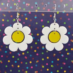 "Everything is coming up daisies! -Lightweight acrylic -Gold plated / stainless steel french hooks -Measurements: 1.6\" x 1.6\" Designed and handcrafted in Chattanooga, TN Actual colors may vary slightly due to differences in monitors and browsers. Contact us if you have any questions!" Retro White Dangle Earrings, Trendy White Plastic Earrings, Trendy White Earrings, Handmade White Plastic Earrings, White Plastic Summer Jewelry, White Plastic Jewelry For Summer, Retro White Dangle Jewelry, Retro White Earrings For Gift, White Nickel Free Flower Earrings For Spring