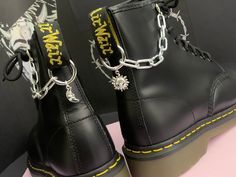 Welcome to this listing for our awesome stainless steel Sun & Moon boot chains! - Chunky stainless steel boot chains (Thick amazing quality!) - Sun & Moon charms - Stainless steel boot clip to hang off the back tag 2.5cm x 2.5 cm - Photographed on UK size 6 Dr Marten 1460 to give you and idea how they will look on your boots! - These can also be used as a cool bag/jeans chain or on other boots like Demonia or New rocks. - These come as a pair, one for each boot. These would make a fabulous gift for someone who loves their Dr Martens or a cheeky treat for yourself!   BOOT CHAINS COME IN AUTBOX ORGANZA GIFT BAG WE HAVE MATCHING NECKLACES AND BOOT CHARMS PLEASE SEE OUR OTHER LISTINGS. IF YOU HAVE ANY QUESTIONS POP ME A MESSAGE, IM ALWAYS HAPPY TO HELP. :) Updated Closet, Steel Boots, New Rocks, Boot Charms, Jeans Chain, Dr Martens Style, Martens Style, Boot Chains, Bag Jeans