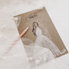 a card with a drawing of a bride on it