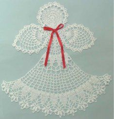 white crocheted angel ornament with red ribbon and bow on light blue background