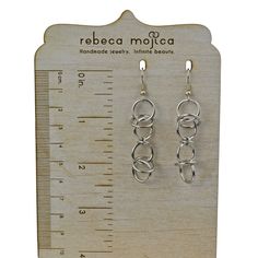 These lightweight earrings pair well with the Airy Orbital necklace. Earrings measure approximately 2.5" long. Stainless steel links and earwire. Wire Wrapped Long Drop Metal Jewelry, Wire Wrapped Metal Long Drop Jewelry, Nickel Free Chain Link Metal Jewelry, Nickel-free Chain Link Jewelry, Nickel-free Metal Chain Link Jewelry, Modern Metal Earrings With French Hook, Handmade Metal Linear Earrings, Wire Wrapped Metal Chandelier Earrings, Silver Plated Wire Dangle Earrings