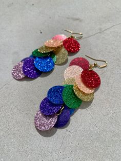 Glitter edition - Be a rainbow in someone's cloud sequin earrings with 18K gold plated stainless steel earring hooks by SaraBokwallDesign. Be a rainbow in someone's cloud - Glitter edition! 🪩 With the additional violet layer. With the additional allure. Leave a little sparkle wherever you go! ✨ Follow me on Instagram: @sarabokwalldesign Sara Bökwall Design - with passion for pearls! ✨ Cheap Rainbow Teardrop Earrings, Sequin Earrings, Glitter Earrings, Rainbow Earrings, Earring Hooks, Stainless Steel Earrings, Best Christmas Gifts, Eras Tour, A Rainbow